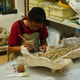 Researchers at the Mongolia Institute of Paleontology examining a fossil from the Gobi.